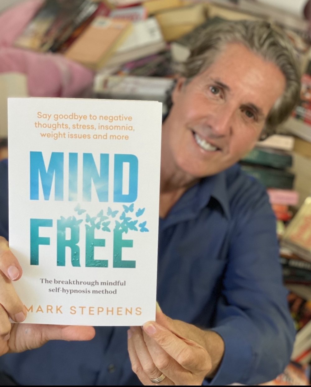 Mark Stephens holding his book Mind Free