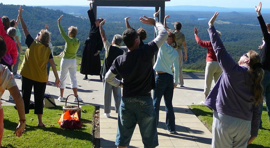 A group doing Tai Chi with Mark at Little Forest, overlooking the coast